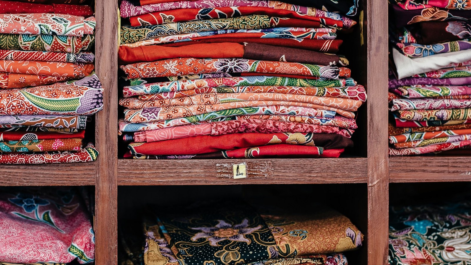 Colorful fabric and clothing used to illustrate chakra colors and intentional dressing