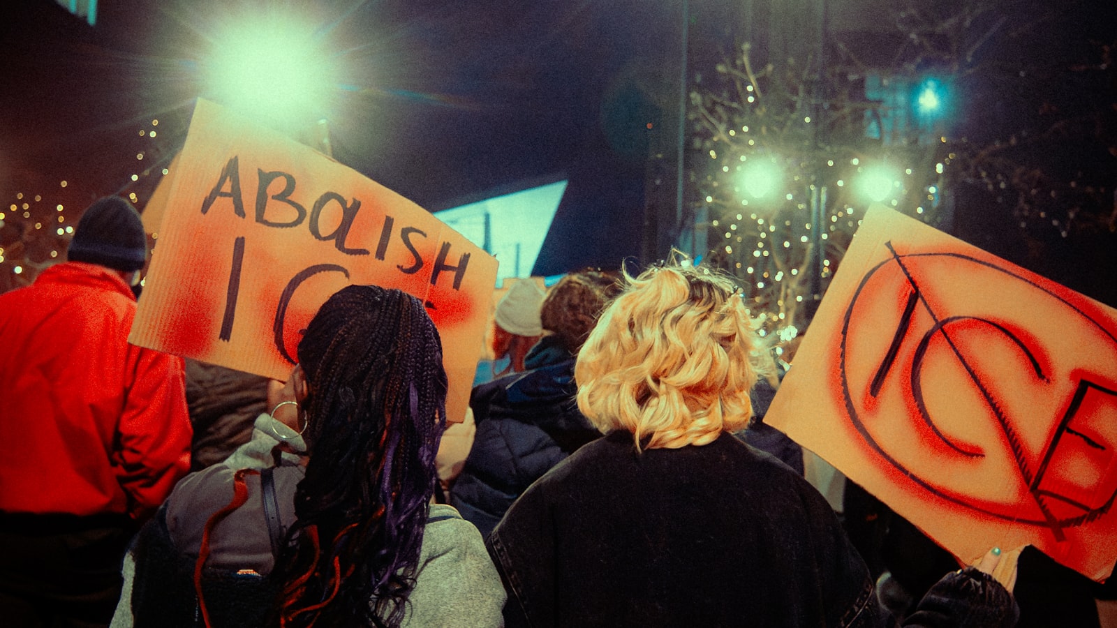 People at a peaceful night rally representing courage compassion and civic action