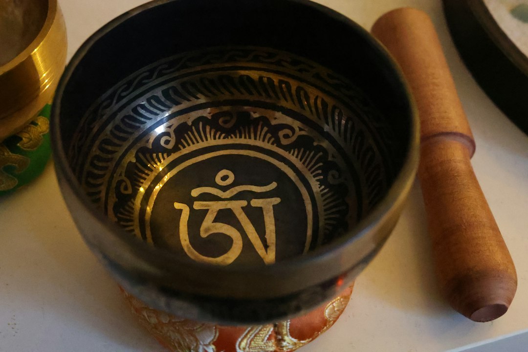 The questions to ask before you explore spirituality without copying someone else's practice A tibetan singing bowl with ornate carvings and sacred symbols