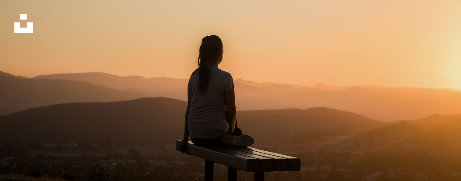 How to start small and practise everyday spirituality without pretending to be calm Woman sitting on bench over viewing mountain